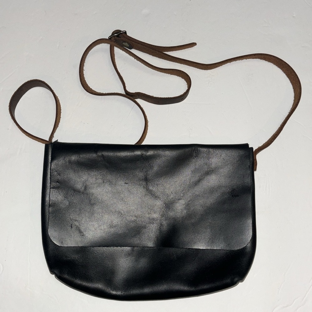 In blue handmade leather crossbody bag